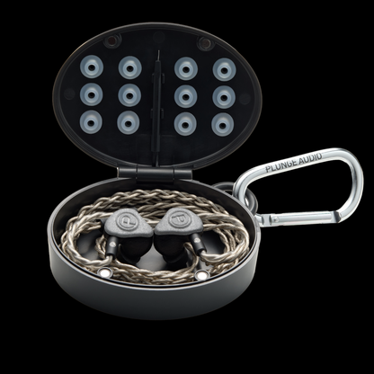 Unity Dynamic grey IEMs in open oval case.