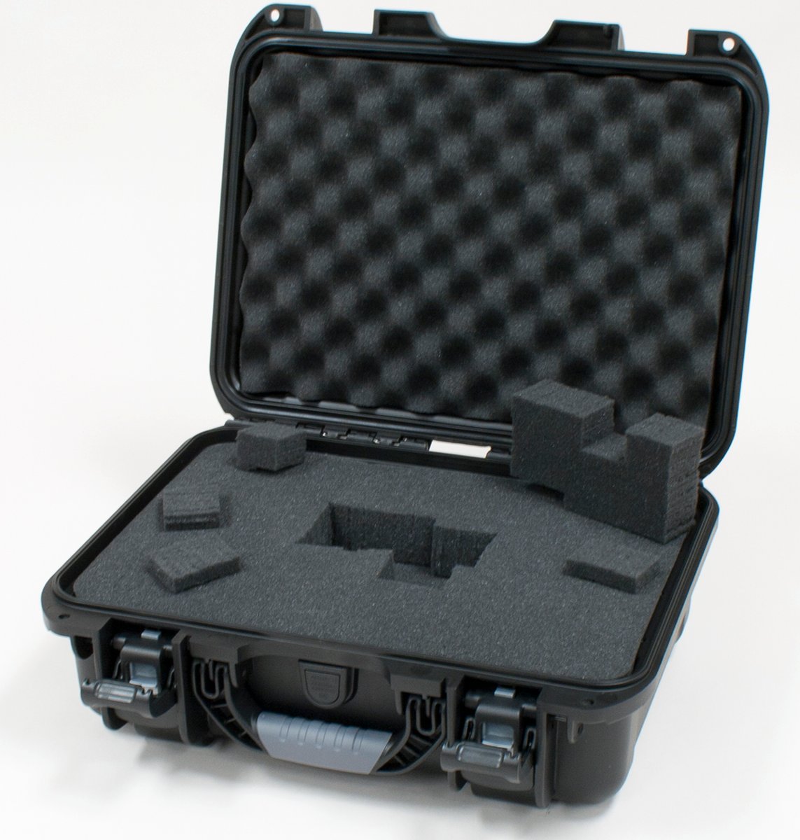 Black waterproof injection molded case with interior dimensions of 15" x 10.5" x 6.2". DICED FOAM